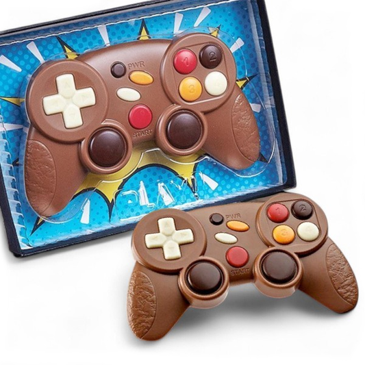 Manette de jeux vidéo en chocolat au lait présentée dans son coffret, idée cadeau originale et gourmande pour passionnés de jeux vidéo.