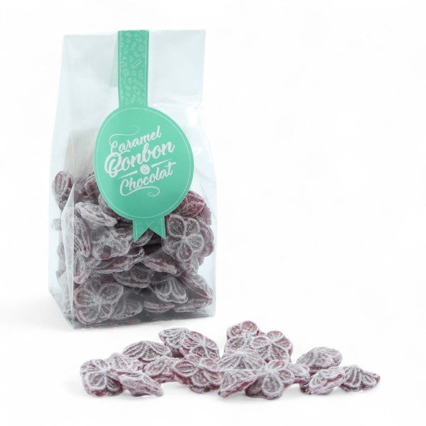 Sachet de bonbons traditionnels à la violette de Toulouse, confiseries en sucre cuit à la saveur florale et raffinée.
