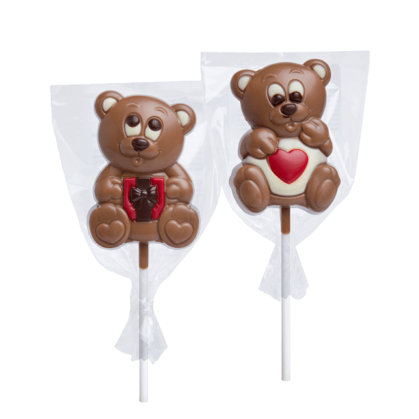 Deux sucettes Ourson en chocolat au lait et blanc de 35g en forme de cœur, gourmandises tendres et réconfortantes pour petits et grands.