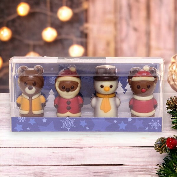Mini coffret de figurines en chocolat 40g présenté dans un décor de Noël, assortiment festif et gourmand à offrir.