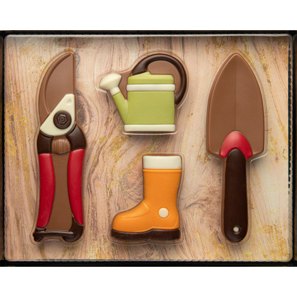 Coffret jardinier en chocolat au lait supérieur, assortiment gourmand d’outils de jardin en chocolat fondant.