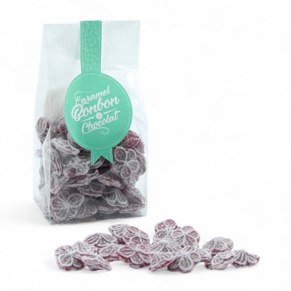 Sachet de bonbons traditionnels à la violette de Toulouse, confiseries en sucre cuit à la saveur florale et raffinée.