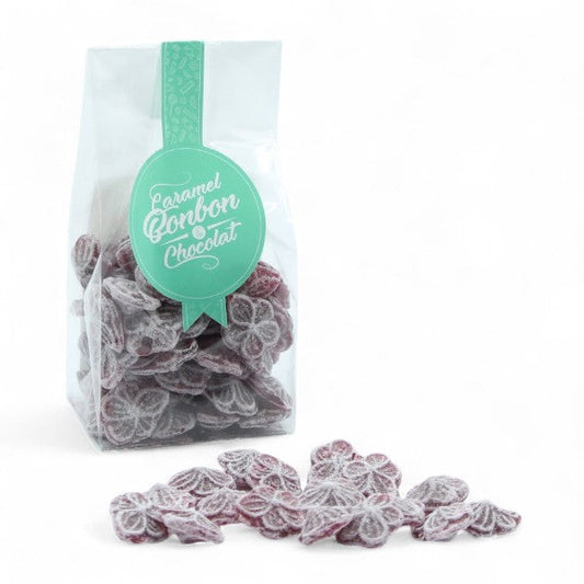 Sachet de bonbons traditionnels à la violette de Toulouse, confiseries en sucre cuit à la saveur florale et raffinée.