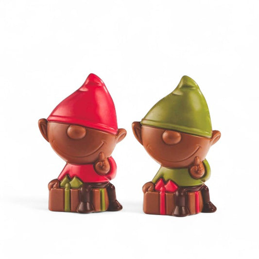 Deux lutins de Noël en chocolat au lait, l’un rouge et l’autre vert, petites douceurs colorées et festives à offrir.