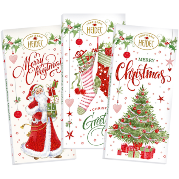 Trois tablettes de chocolat “Noël blanc” au lait supérieur de 100 g, emballées dans un papier illustré blanc et rouge festif.