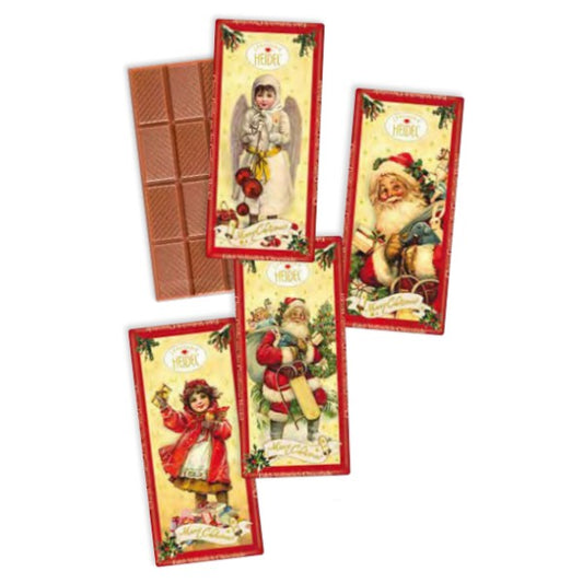 Quatre tablettes de chocolat “Nostalgie” au lait, chocolat supérieur fondant au goût doux et onctueux.