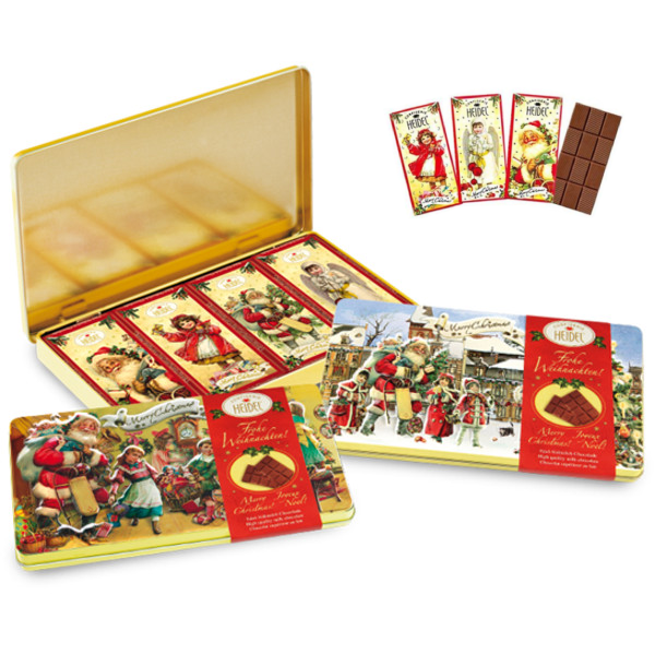 Boîte décorative “Nostalgie” de Noël 120g ouverte avec quatre petites tablettes de chocolat au lait de 30g, coffret gourmand et festif.