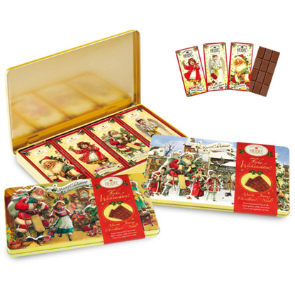 Boîte décorative “Nostalgie” de Noël 120g ouverte avec quatre petites tablettes de chocolat au lait de 30g, coffret gourmand et festif.