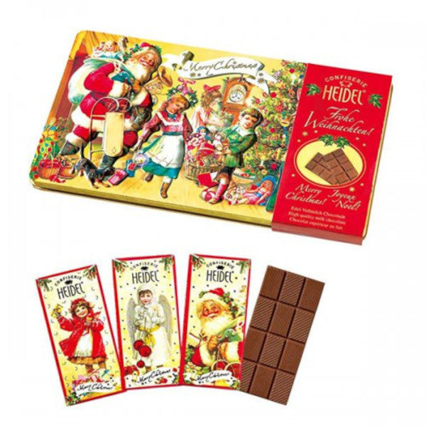 Trois petites tablettes de chocolat au lait “Nostalgie” de Noël 30g, chocolat supérieur fondant au goût doux et onctueux.