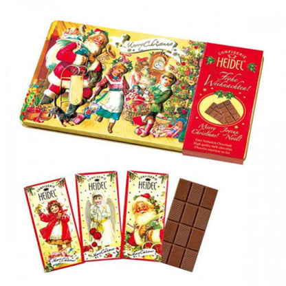 Trois petites tablettes de chocolat au lait “Nostalgie” de Noël 30g, chocolat supérieur fondant au goût doux et onctueux.