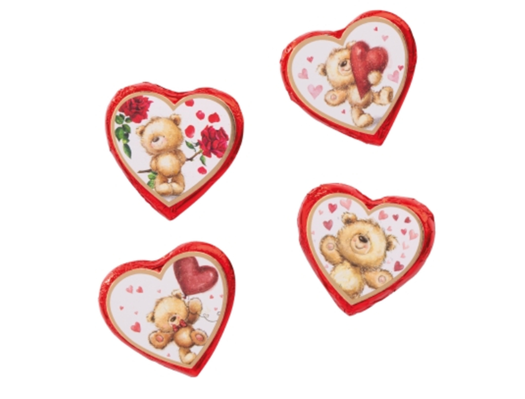 Quatre Cœurs Ourson en chocolat au lait fourrés à la crème pralinée, chocolats fondants aux motifs variés et couleurs assorties.