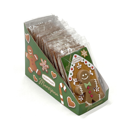 Présentoir de bonshommes en pain d’épices en pâte d’amande décorés en sucre, parfaits comme petits cadeaux de table gourmands.