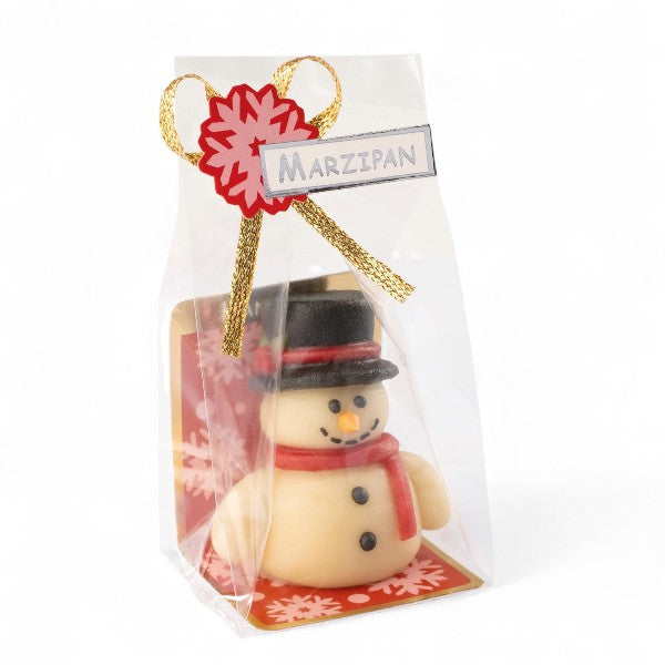Pâte d’amande Bonhomme de Neige présentée en sachet, décorée en sucre, idéale comme petit cadeau de table pour Noël.