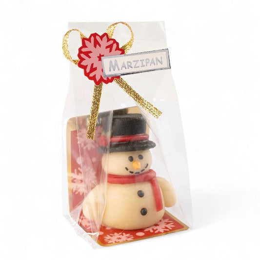 Pâte d’amande Bonhomme de Neige présentée en sachet, décorée en sucre, idéale comme petit cadeau de table pour Noël.