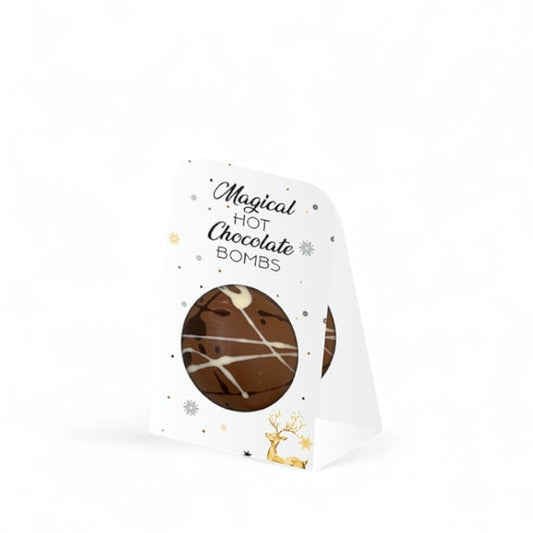Étui boule magique à chocolat chaud de 45g, boule en chocolat à faire fondre dans du lait chaud avec intérieur de mini guimauves fondantes, idée cadeau gourmande et réconfortante.