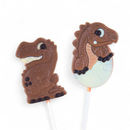 Deux sucettes dinosaure en chocolat au lait belge, gourmandises ludiques et colorées pour enfants.