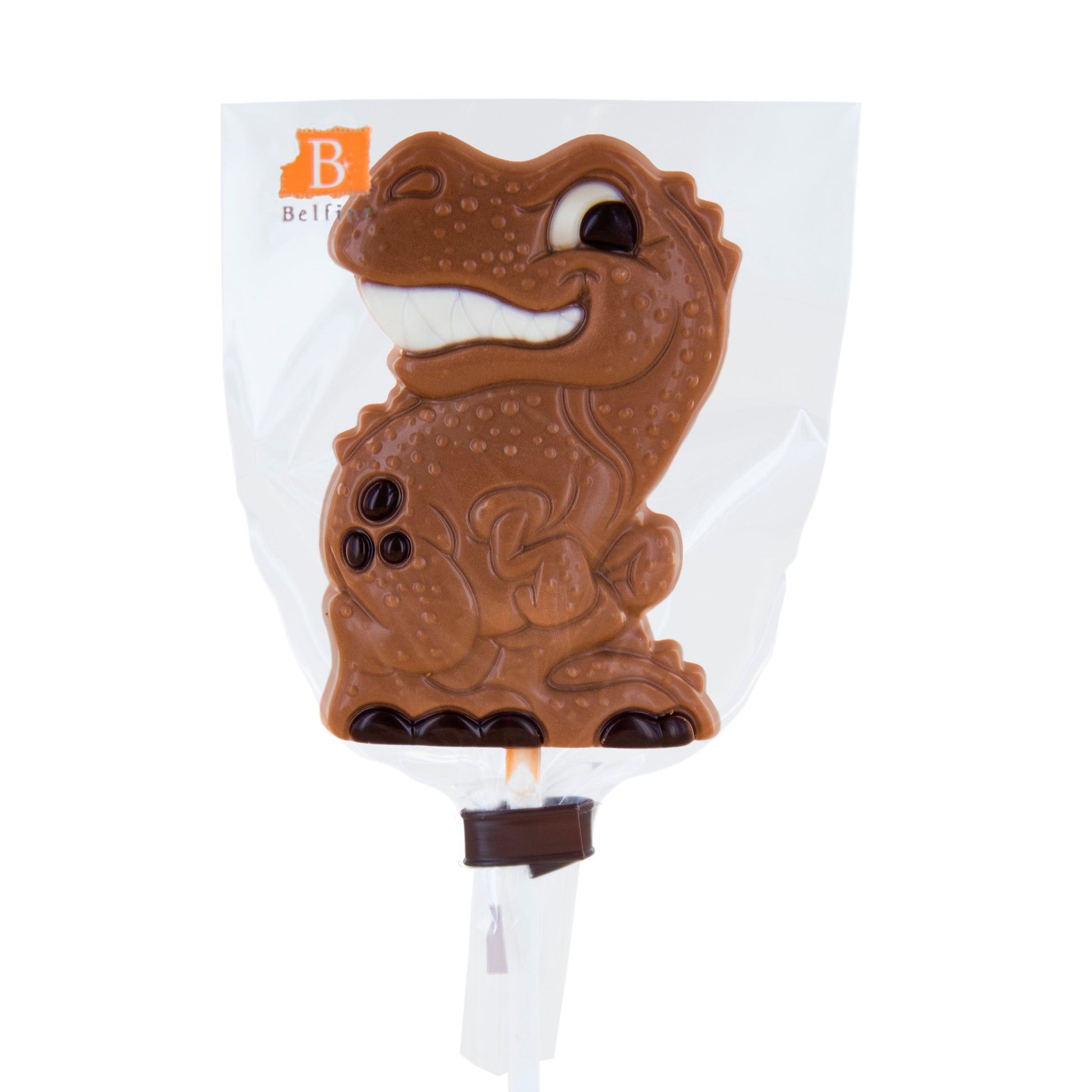 Sucette dinosaure en chocolat au lait emballée individuellement dans un sac transparent, friandise amusante et gourmande.