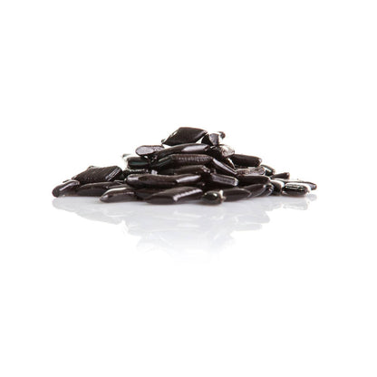 Réglisses dures italiennes “Rombetti” en vrac, bonbons en forme de losange au goût subtil de réglisse et d’anis.